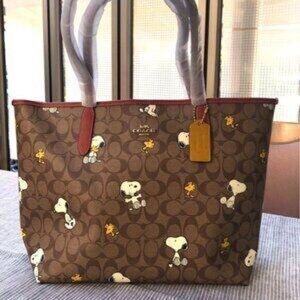 Coach X Peanuts City Tote In Signature Canvas With Snoopy Woodstock Print